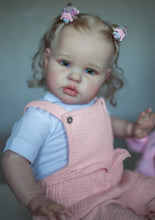 Load image into Gallery viewer, 24inch Reborn Baby Girl Ellie - Blonde Rooted Hair in Pigtails & Blue Eyes, Pink Sheer Overalls with White Onesie, Plush Body & Butterfly Pacifier