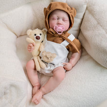 Carica l'immagine nel visualizzatore di Gallery, Adorable 19-Inch Reborn Baby Doll in White Overalls & Brown Hoodie - Full Vinyl, Premium Paint, Hand-Painted Hair