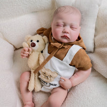 Carica l'immagine nel visualizzatore di Gallery, Adorable 19-Inch Reborn Baby Doll in White Overalls & Brown Hoodie - Full Vinyl, Premium Paint, Hand-Painted Hair