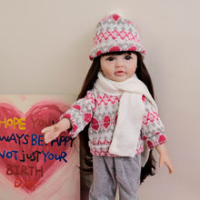 Carica l'immagine nel visualizzatore di Gallery, 55cm Reborn Baby Girl Doll "Betty" with Long Brown Hair, Blue Eyes, Full Vinyl Body | Wearing Flower Sweater + White Sneakers