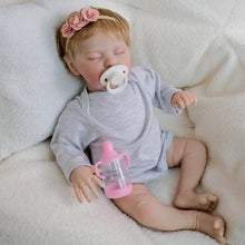Carica l'immagine nel visualizzatore di Gallery, 19" Sleeping Reborn Baby Doll Teddy - Rooted Blonde Hair, Heather Gray Footed Sleeper + Floral Headband, Eyes Closed