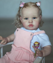 Load image into Gallery viewer, 24inch Reborn Baby Girl Ellie - Blonde Rooted Hair in Pigtails & Blue Eyes, Pink Sheer Overalls with White Onesie, Plush Body & Butterfly Pacifier