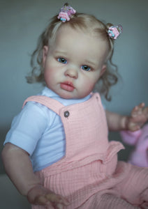 24inch Reborn Baby Girl Ellie - Blonde Rooted Hair in Pigtails & Blue Eyes, Pink Sheer Overalls with White Onesie, Plush Body & Butterfly Pacifier