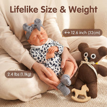 Carica l'immagine nel visualizzatore di Gallery, 12.6" Sleeping Weighted Reborn Silicone Baby Doll | 2.4 lbs (1.1kg) Lifelike Size &amp; Weight | Openable Mouth for Feeding &amp; Pacifier | Premium Platinum Silicone | Cow Print Romper &amp; Striped Bow

