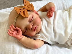 19 inch 48cm Gallery-Level Reborn Baby Irys- Hand-Painted Portrait, Cloth Body + Deep Blush Bow & Strapless Romper