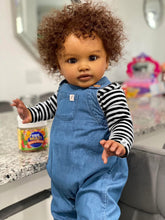 Cargar imagen en el visor de la galería, 26&quot; Deep Skin Baby Doll with Implanted Brown Afro &amp; 3D Eyes - Denim Overalls w/ Black-White Striped Lining - Realistic Pippa
