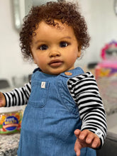 Cargar imagen en el visor de la galería, 26&quot; Deep Skin Baby Doll with Implanted Brown Afro &amp; 3D Eyes - Denim Overalls w/ Black-White Striped Lining - Realistic Pippa
