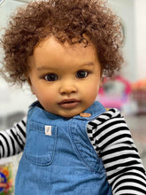 Cargar imagen en el visor de la galería, 26&quot; Deep Skin Baby Doll with Implanted Brown Afro &amp; 3D Eyes - Denim Overalls w/ Black-White Striped Lining - Realistic Pippa

