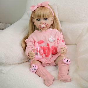 22 Inch Full Vinyl Reborn Baby Girl - Blonde Wig, Blue Eyes, Gentle Paint "Betty" in Pink Bunny Print Long Sleeve Onesie