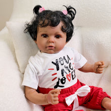 Load image into Gallery viewer, Lucy 20-Inch Reborn Baby Dolls Cloth Soft Body African American Reborn Toddler Doll - Curly Black Hair, Brown Eyes, Graphic Tee Outfit
