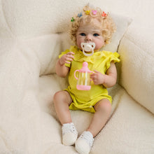 Cargar imagen en el visor de la galería, Blonde Curly Hair Bettie Reborn Baby Doll - 18&quot; Cloth Body Girl in Yellow Romper with Flutter Sleeves &amp; Round Collar - Blue Eyes
