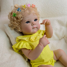 Cargar imagen en el visor de la galería, Blonde Curly Hair Bettie Reborn Baby Doll - 18&quot; Cloth Body Girl in Yellow Romper with Flutter Sleeves &amp; Round Collar - Blue Eyes
