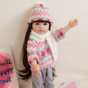 55cm Reborn Baby Girl Doll "Betty" with Long Brown Hair, Blue Eyes, Full Vinyl Body | Wearing Flower Sweater + White Sneakers