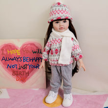 Load image into Gallery viewer, 55cm Reborn Baby Girl Doll &quot;Betty&quot; with Long Brown Hair, Blue Eyes, Full Vinyl Body | Wearing Flower Sweater + White Sneakers
