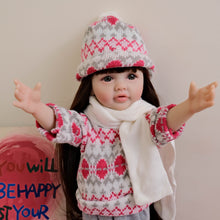 Load image into Gallery viewer, 55cm Reborn Baby Girl Doll &quot;Betty&quot; with Long Brown Hair, Blue Eyes, Full Vinyl Body | Wearing Flower Sweater + White Sneakers
