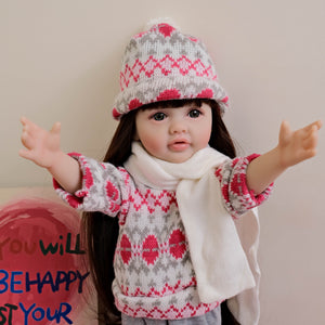 55cm Reborn Baby Girl Doll "Betty" with Long Brown Hair, Blue Eyes, Full Vinyl Body | Wearing Flower Sweater + White Sneakers
