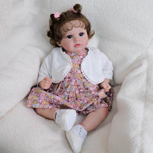 Cargar imagen en el visor de la galería, 20 inch Caucasian Baby Doll Arianna - Rooted Brunette Curls &amp; Vivid Blue Eyes | Brown Floral Dress  Ultra-Snuggly Cloth Body
