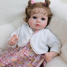 Cargar imagen en el visor de la galería, 20 inch Caucasian Baby Doll Arianna - Rooted Brunette Curls &amp; Vivid Blue Eyes | Brown Floral Dress  Ultra-Snuggly Cloth Body
