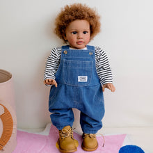 Cargar imagen en el visor de la galería, 26&quot; Deep Skin Baby Doll with Implanted Brown Afro &amp; 3D Eyes - Denim Overalls w/ Black-White Striped Lining - Realistic Pippa
