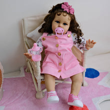 Cargar imagen en el visor de la galería, 24&quot; African American Baby Doll Ellie - Rooted Long Brown Curls &amp; Chocolate Eyes | Pink Overalls with Floral Lining | Ultra-Soft Cloth Body
