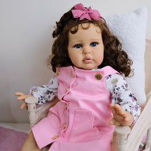 Cargar imagen en el visor de la galería, 24&quot; African American Baby Doll Ellie - Rooted Long Brown Curls &amp; Chocolate Eyes | Pink Overalls with Floral Lining | Ultra-Soft Cloth Body
