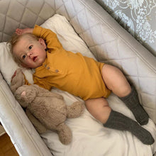 Carregar imagem no visualizador da galeria, 28 inch Realistic Boy Baby Doll - 70cm Liam with Rooted Blonde Hair, Hand-Painted Features &amp; Brown Eyes. Fabric Body in Yellow Sleeper.
