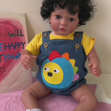 Load and play video in Gallery viewer, 23&quot; 58cm Cloth Body Doll with Full Arms &amp; Legs - Ayana Africa-American Reborn Black Planted Hair Black Curly Hair with Red Bowknot Dinosaur Suspender Pants
